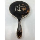 Tortoise shell backed mirror with Silver inlay and silver frame and handle (hallmarks rubbed)