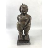 After Botero, a figurine of a rotund lady with eyes closed, approx 37cm tall, mounted on black