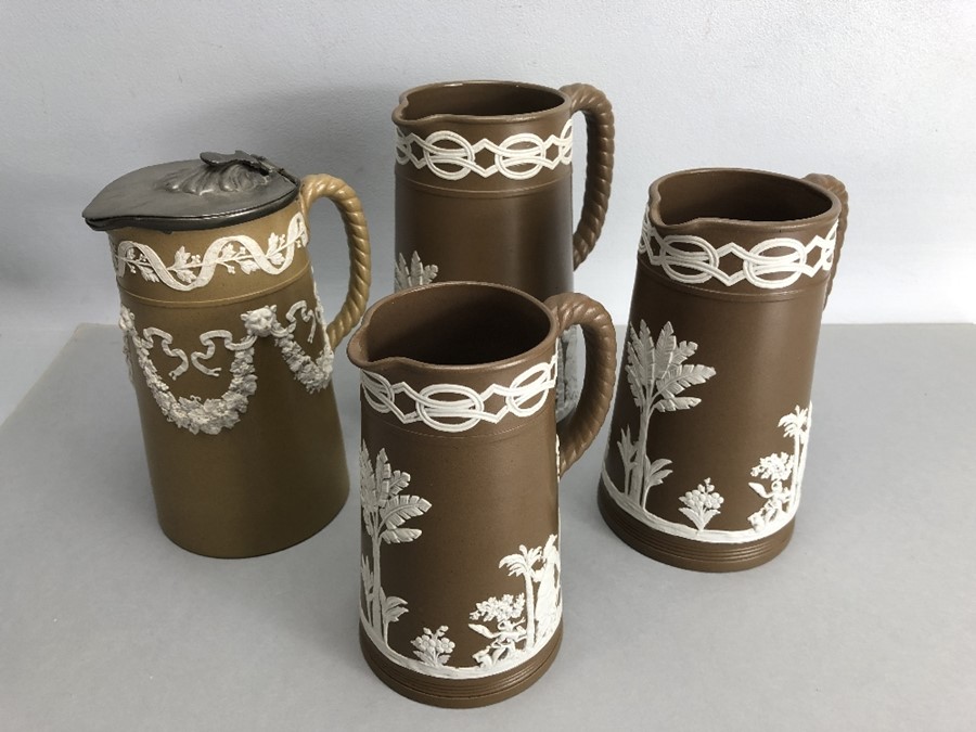 Collection of four Wedgewood Brown and white Jasperware jugs with rope effect handles