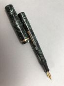 CONWAY STEWART - Vintage green and black fountain pen with gold trim and 14ct gold Conway Stewart