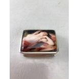 Small rectangular silver pill box with recumbent lady to lid. Stamped 925