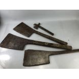 Four vintage tools to include large metal machetes and a small iron axe with claw