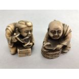 Two Japanese netsuke, both seated and dressed in robes, one eating noodles, approx 4cm in height