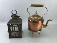 Copper and brass kettle on stand along with a vintage lantern with glass panels and hinged door