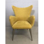 Contemporary yellow-upholstered wingback armchair on tapering chrome legs, approx 65cm wide x 58cm