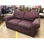 Purple upholstered two seater sofa