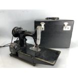 A Singer (222K) sewing machine in case