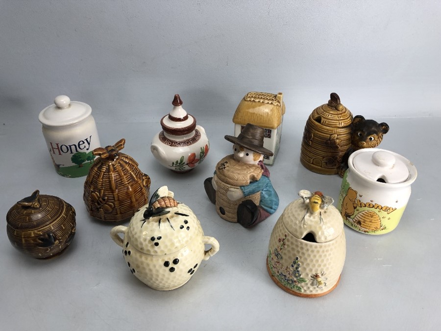 Small collection of eleven honey pots to include one by Price Bros.