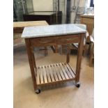 Granite-topped kitchen unit / trolley on castors, with two drawers, baskets and shelf under