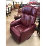 Red leather recliner / rocker armchair