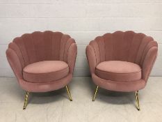 Pair of modern Art-Deco style pink velvet scalloped back chairs with brass coloured legs, approx