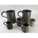 Five pewter cups and a measure, the largest approx 11cm tall