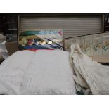Suitcase of mixed linen, unused boxed embroidered napkins,