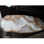 Draft gilt framed oval side table with veined brown mottled onyx top,