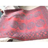 Fine tasseled wool vivid red and blue ground carpet,