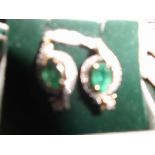 Pair of emerald and diamond earrings