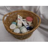 Wicker basket containing a selection of ladies cosmetics