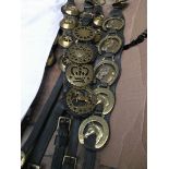 5 Leather straps containing a selection of early brasses incl.