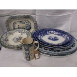 Selection of oval blue and white meat dishes, WW I milk jug, ironstone soup plates etc.