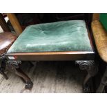 Victorian mahogany rectangular stool on ornate shaped ball and claw feet,