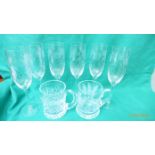 6 etched glass champagne flutes and 2 cut glass edged ale tankards