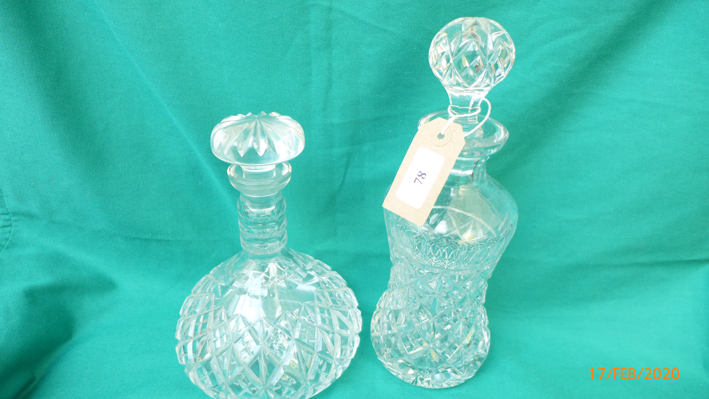 Port decanter on circular plated tray and a spirit decanter with golf ball stopper