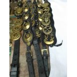 6 Leather straps containing a selection of early brasses incl.