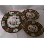 3 almost matching ironstone multi-coloured dark green ground floral plates,