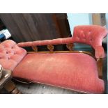Edwardian oak framed chaise longue, the buttoned backed arms and back upholstered in pink dralon,