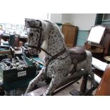 FINE EXAMPLE OF A LATE VICTORIAN MOTTLE GREY ROCKING HORSE WITH LEATHER SADDLE AND REINS ON