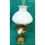 Brass oil lamp with clouded glass shade