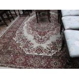Large beige and port ground lounge carpet floral pattern diamond to the central field (96" x 132")