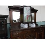 Large mahogany Edwardian sideboard, the upper hooded portion inset shaped bevel edged mirror,