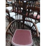 Mahogany high and bow backed Edwardian armchair with 8 turned vertical sticks to back,