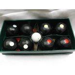 Box of 8 carpet bowls and jack