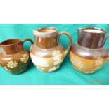 Early 20th century Royal Doulton brown stoneware water jugs with raised decoration,