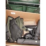 Green fishermans box together with waterproof gloves, rod transporters etc.