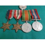 String of WW II medals awarded to RC Stocks number 14519988 RM Comando