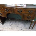 Bow fronted inlaid Edwardian side table fitted 2 long and 2 small drawers each with drop handles on