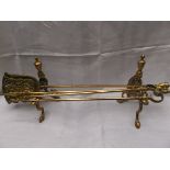 Set brass fire dogs and 3 long armed brass fire implements