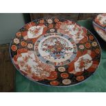 Large circular Imari decorative plate in traditional colours of rust brown and cobalt blue (22"
