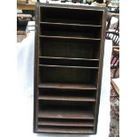 Freestanding oak display cupboard with brass furniture inset 7 small shelves