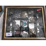 Glass tray top display cabinet containing a selection of principally brooches and other dress