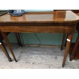 Inlaid mahogany Georgian card table on plain tapering legs,