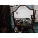 Inlaid Edwardian shield shaped bevel edged toilet mirror on splayed feet united by horizontal