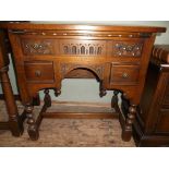 Smaller side table fitted 2 small and 1 long carved fronted drawer on turned feet united by