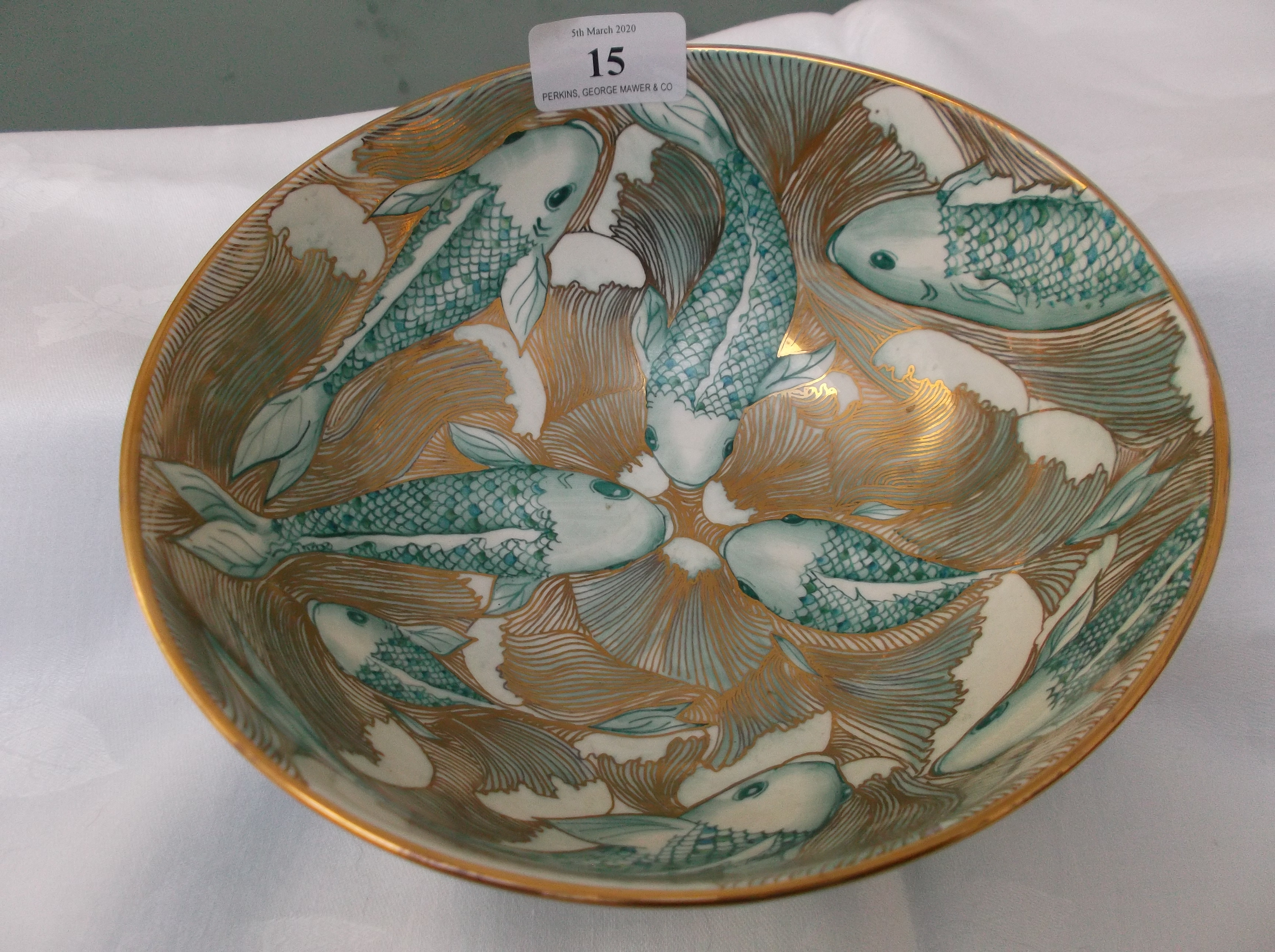 Green ground fruit bowl hand painted and signed by Christina Tomlinson the patterned gilt inset