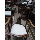 Shaped high backed Edwardian mahogany armchair, carved vertical splat to back,