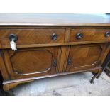 Mahogany sideboard unit on shaped spud feet,