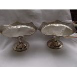 Pair of plated display dishes each on raised circular plinth with pierced raised shaped border ex.